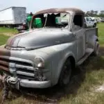 a vintage truck half sandblasted