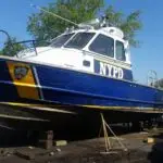 The repainted hull of a boat after marine sandblasting the hull