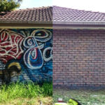 Graffiti removal on a brick building before and after using mobile sandblasting paint stripping